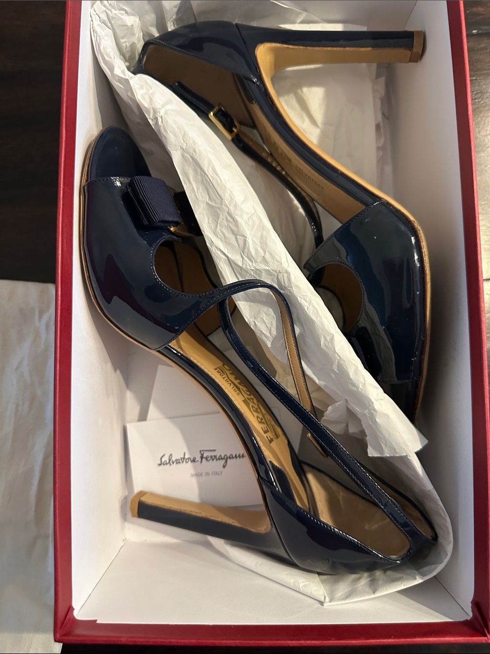 Salvatore Ferragamo Navy Patent Bow Slingback Heels with Gold Accent. Gabrielle